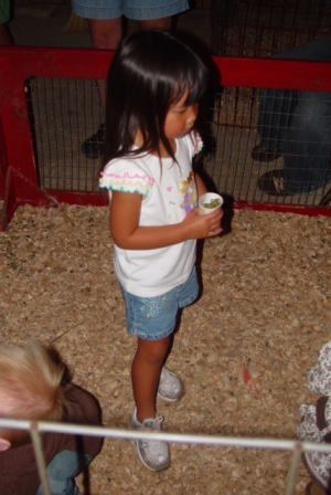 Kasen ready to feed the animals at the petting zoo
